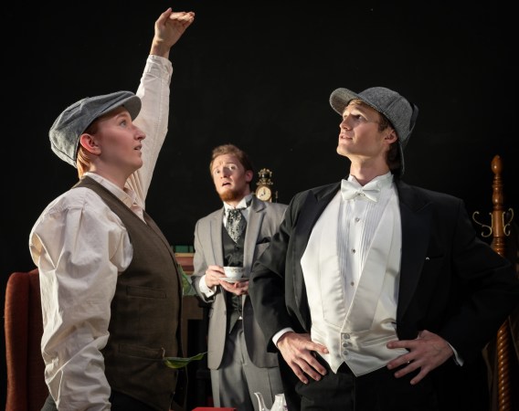 Young Jack (Tayler Edwards) demonstrates the great height of the giant to Sherlock Holmes (Andrew Walton, right) and Dr. Watson (Johnny Derby), center, in "Sherlock Holmes and the Case of the Fallen Giant" at Portland State Opera. Photo: Chad Lanning.