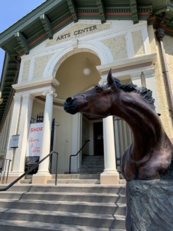 The entrance of the Carnegie library that houses the Pendleton Arts Center was designed to resemble the Pazzi Chapel at the Basilica di Santa Croce in Florence, Italy. Randy Gundlach’s horse statue lends a western touch. Photo by: David Bates